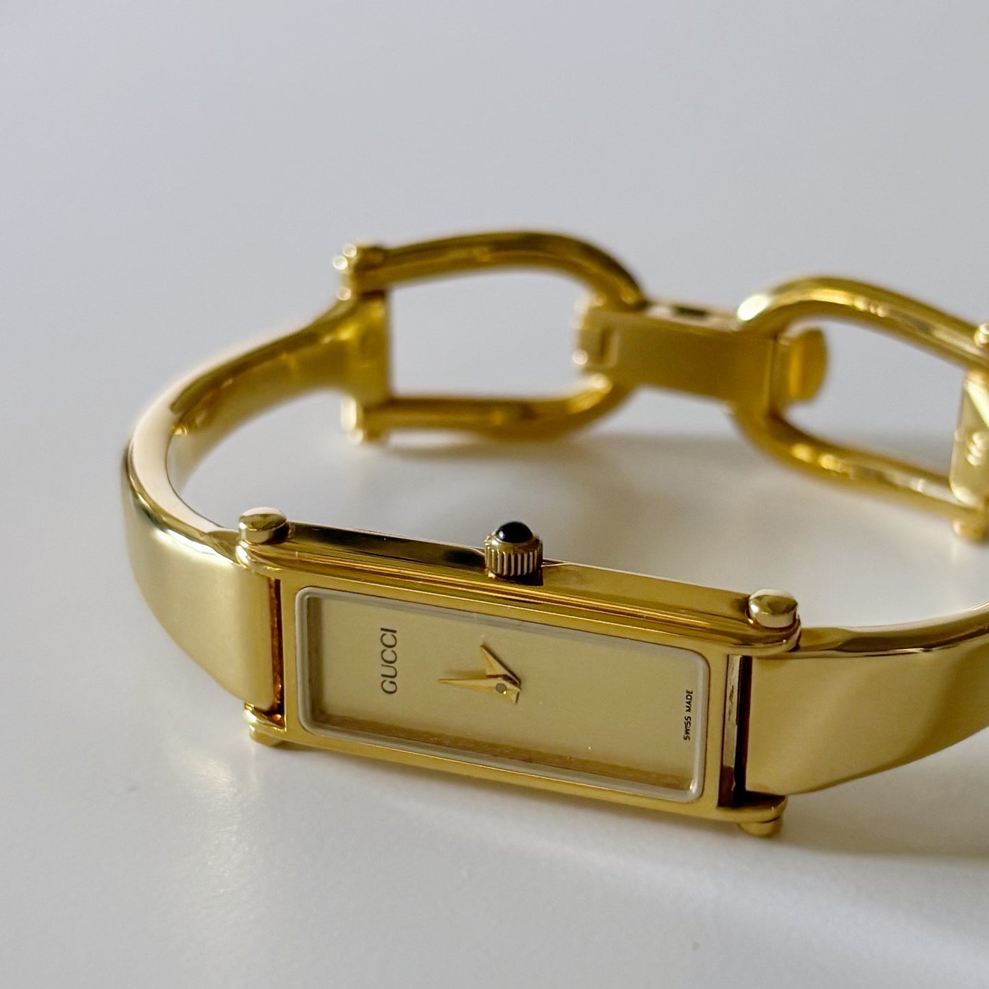 Gucci 1990s Rectangular Gold Dial Gold Plated Bangle Watch (Small)