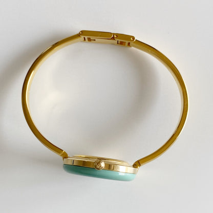 Gucci 1990s Interchangeable Bezel Gold Plated Bangle Watch with 12 bezels, case
