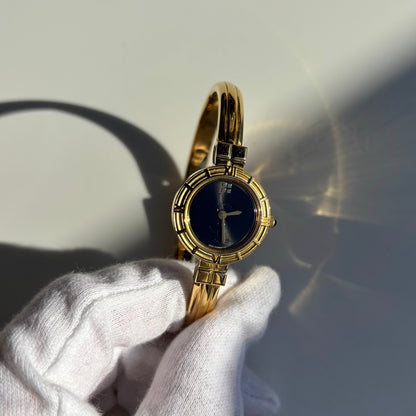 Yves Saint Laurent 1990s Black Round Dial Gold Plated Bangle Watch