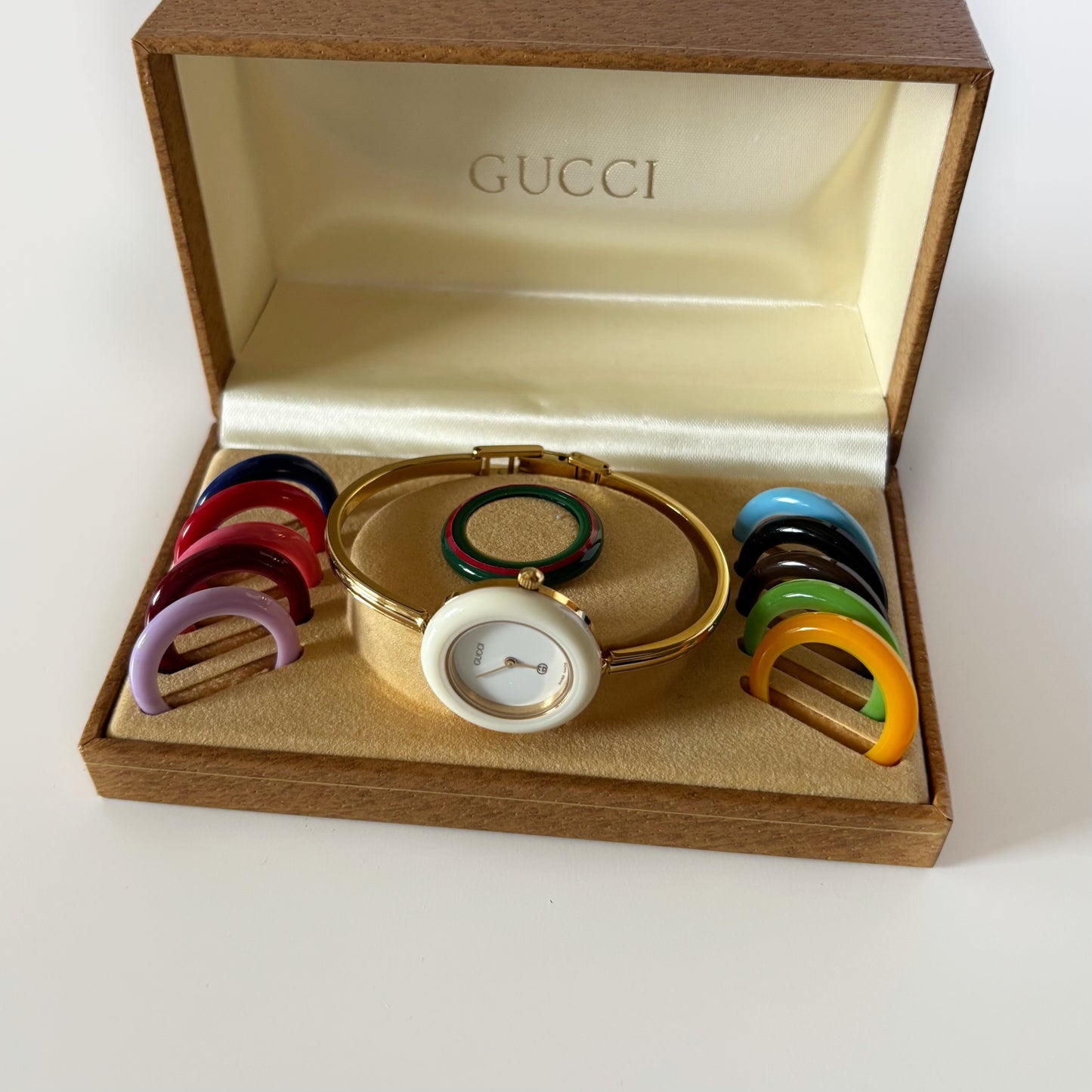 Gucci 1980s Interchangeable Bezel Gold Plated Bangle Watch with 12 bezels, case
