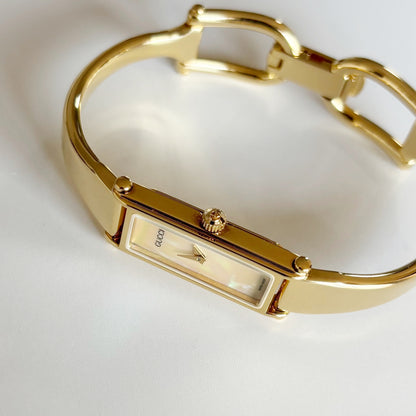 Gucci 1990s Seashell Rectangular Dial Gold Plated Bangle Watch