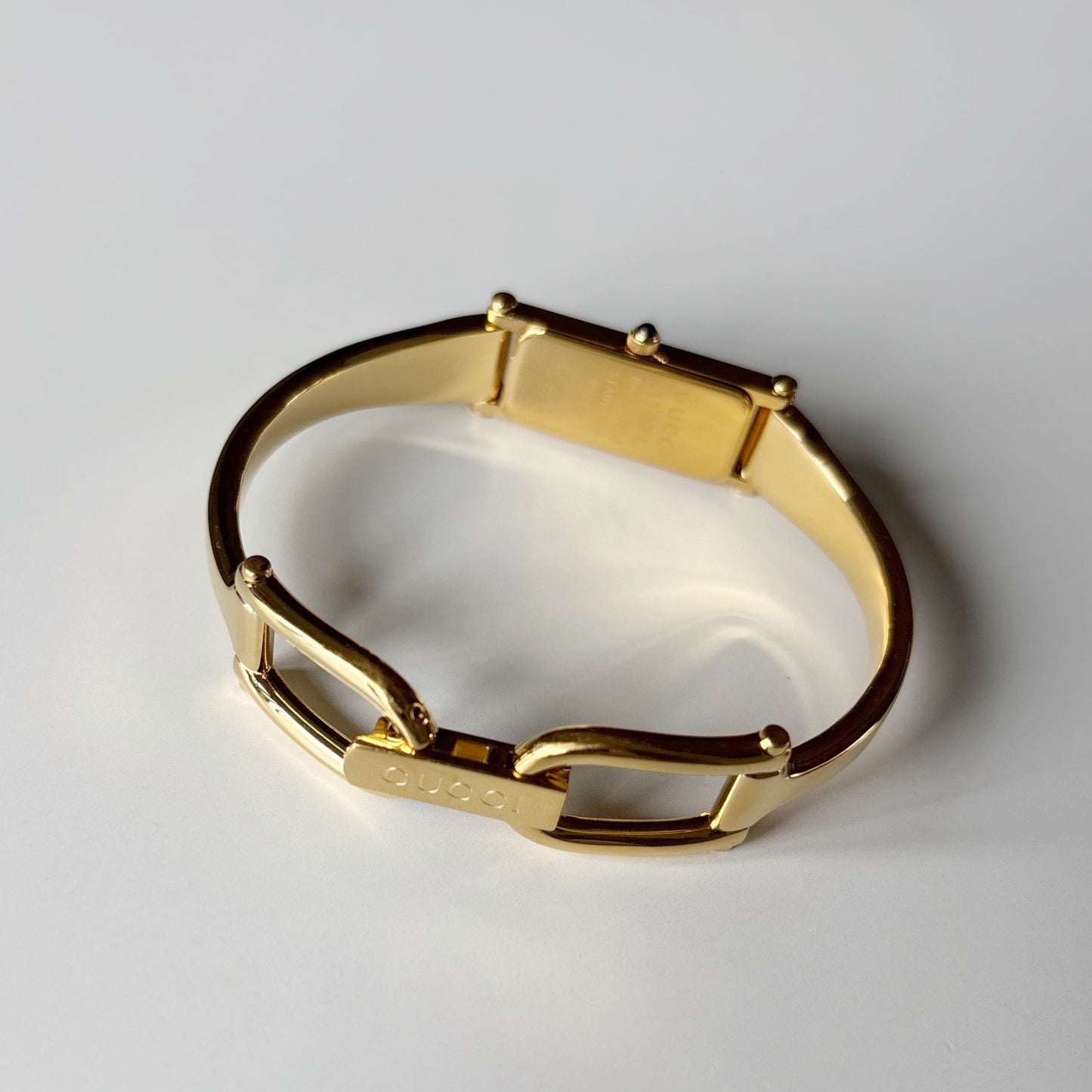 Gucci 1990s Gold Rectangular Dial Gold Plated Bangle Watch