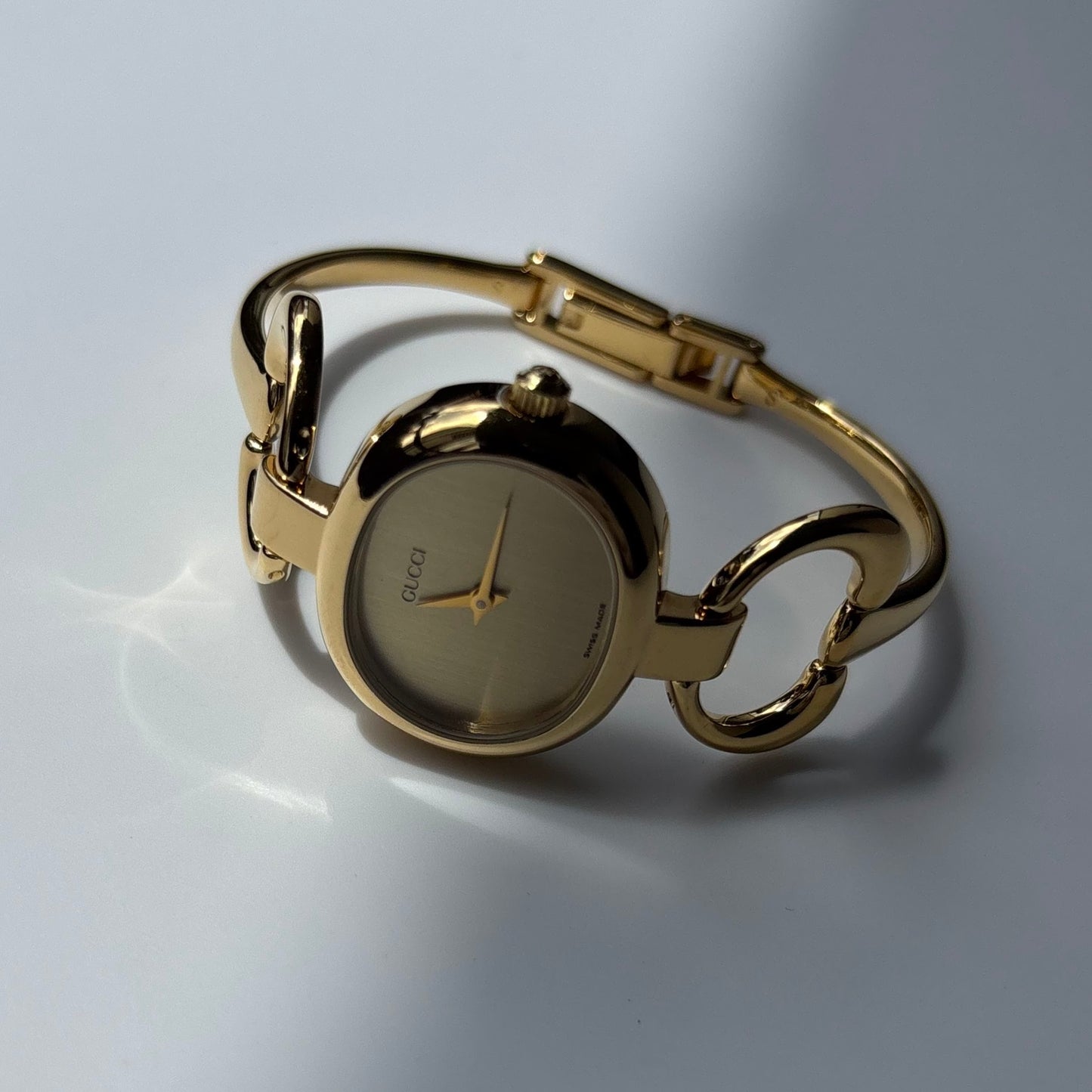 Gucci 1990s Oval Gold Dial Gold Plated Bangle Watch (Small)