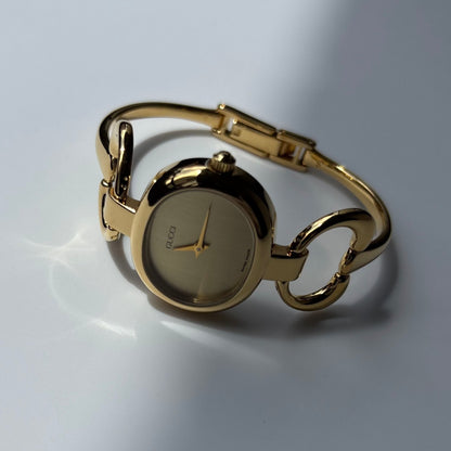 Gucci 1990s Oval Gold Dial Gold Plated Bangle Watch (Small)
