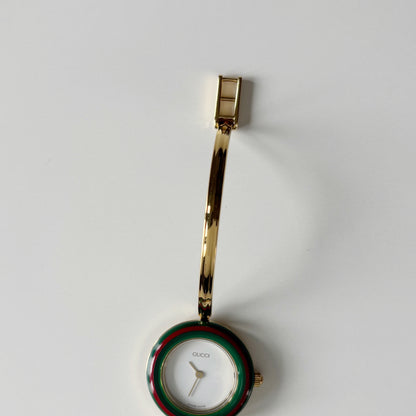 Gucci 1990s Interchangeable Bezel Gold Plated Bangle Watch with 12 bezels, case