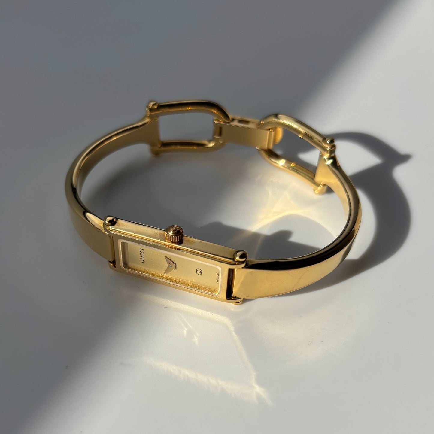 Gucci 1990s Gold Rectangular Dial Gold Plated Bangle Watch