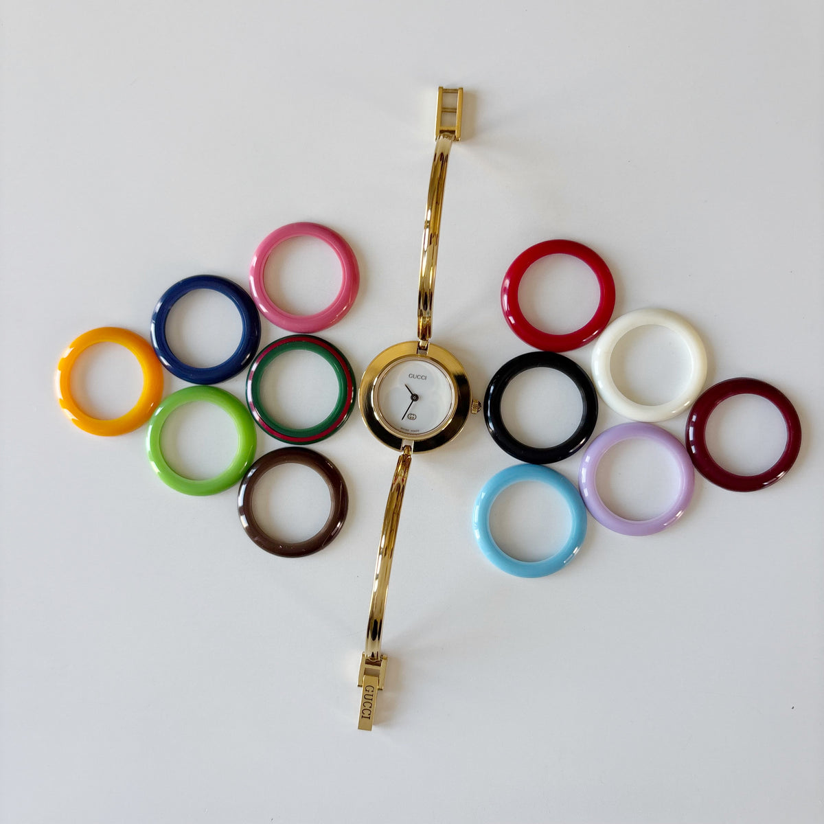 Gucci 1990s Interchangeable Bezel Gold Plated Bangle Watch with 12 bezels, case