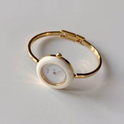 Gucci 1990s Interchangeable Bezel Gold Plated Bangle Watch with case, 12 bezels (Small)