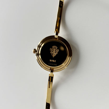 Gucci 1990s Interchangeable Bezel Gold Plated Bangle Watch with 12 bezels, case