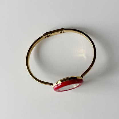 Gucci 1990s Interchangeable Bezel Gold Plated Bangle Watch with 12 bezels, case
