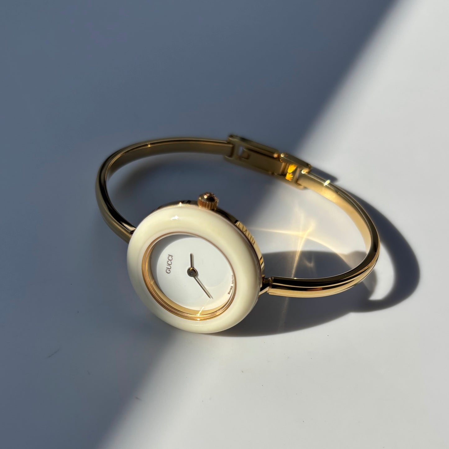 Gucci 1990s Interchangeable Bezel Gold Plated Bangle Watch with 12 bezels, case