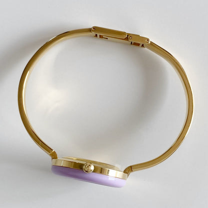 Gucci 1990s Interchangeable Bezel Gold Plated Bangle Watch with 12 bezels, case
