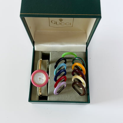 Gucci 1990s Interchangeable Bezel Gold Plated Bangle Watch with 12 bezels, case