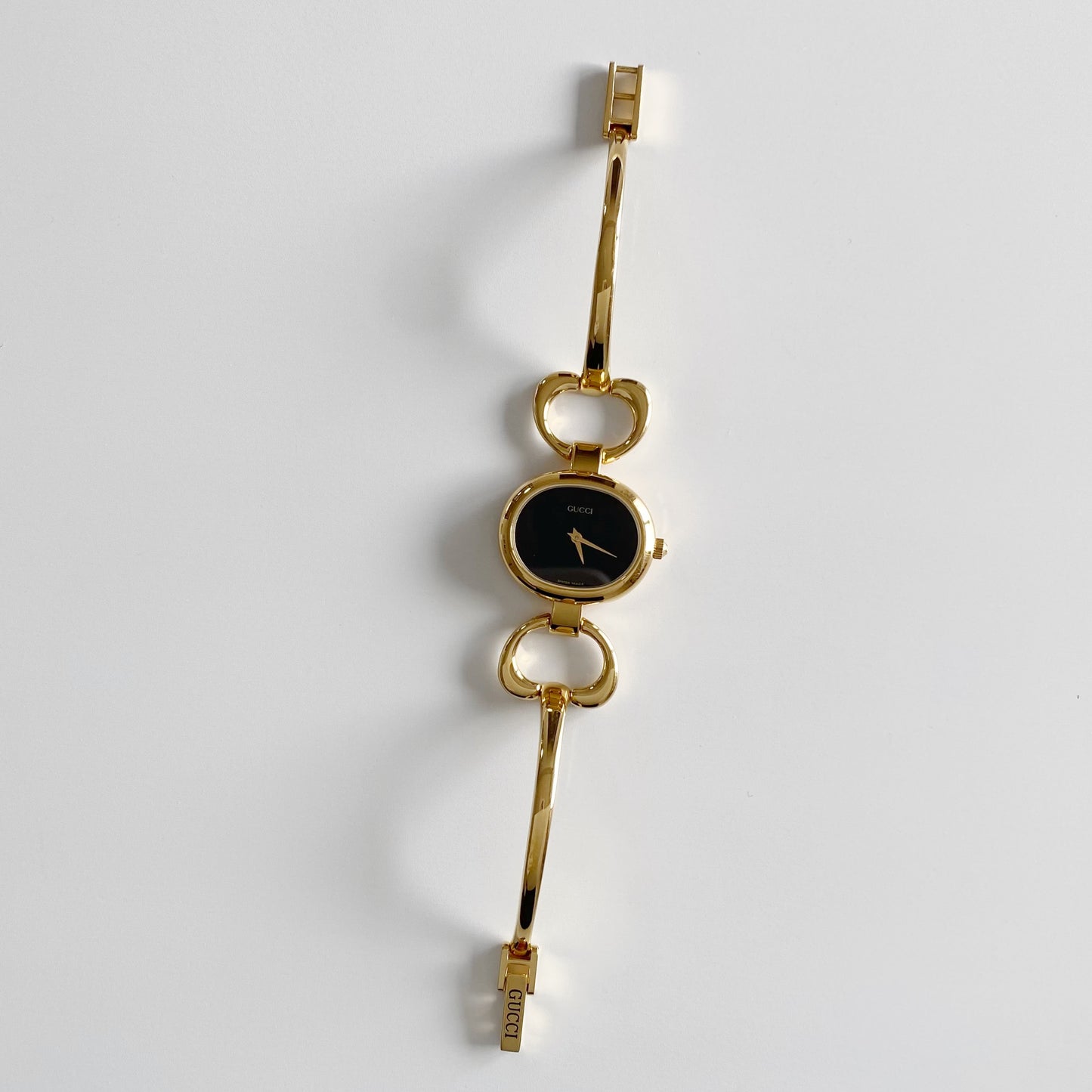 Gucci 1990s Black Dial Gold Plated Bangle Watch