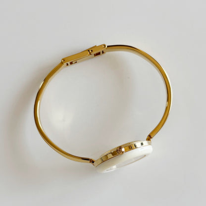 Gucci 1990s Interchangeable Bezel Gold Plated Bangle Watch with 12 bezels, case
