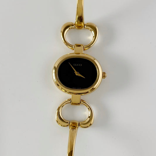 Gucci 1990s Black Oval Dial Gold Plated Bangle Watch