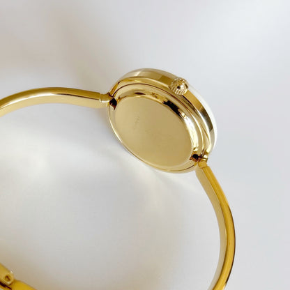 Gucci 1990s Interchangeable Bezel Gold Plated Bangle Watch with 12 bezels, case
