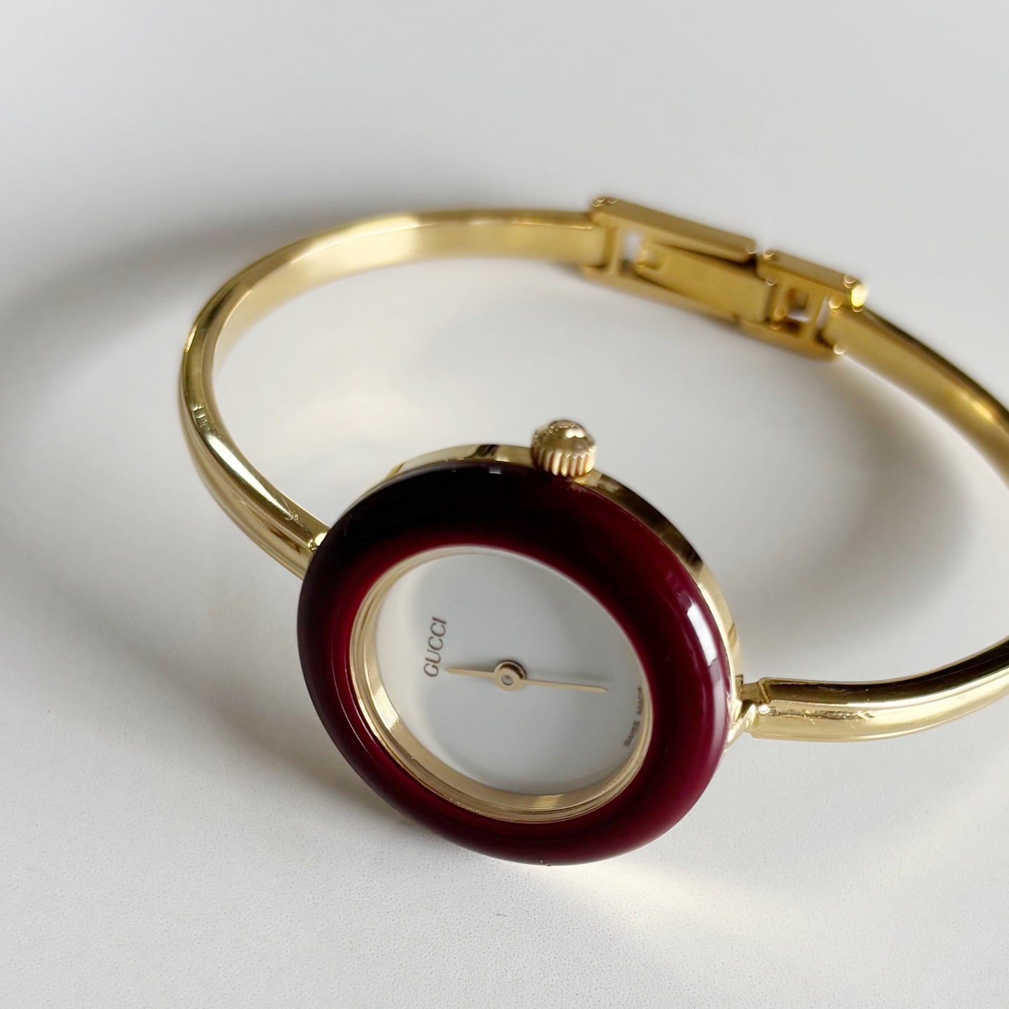 Gucci 1990s Interchangeable Bezel Gold Plated Bangle Watch with 12 bezels, case