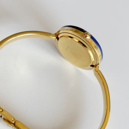 Gucci 1990s Interchangeable Bezel Gold Plated Bangle Watch with 12 bezels, case