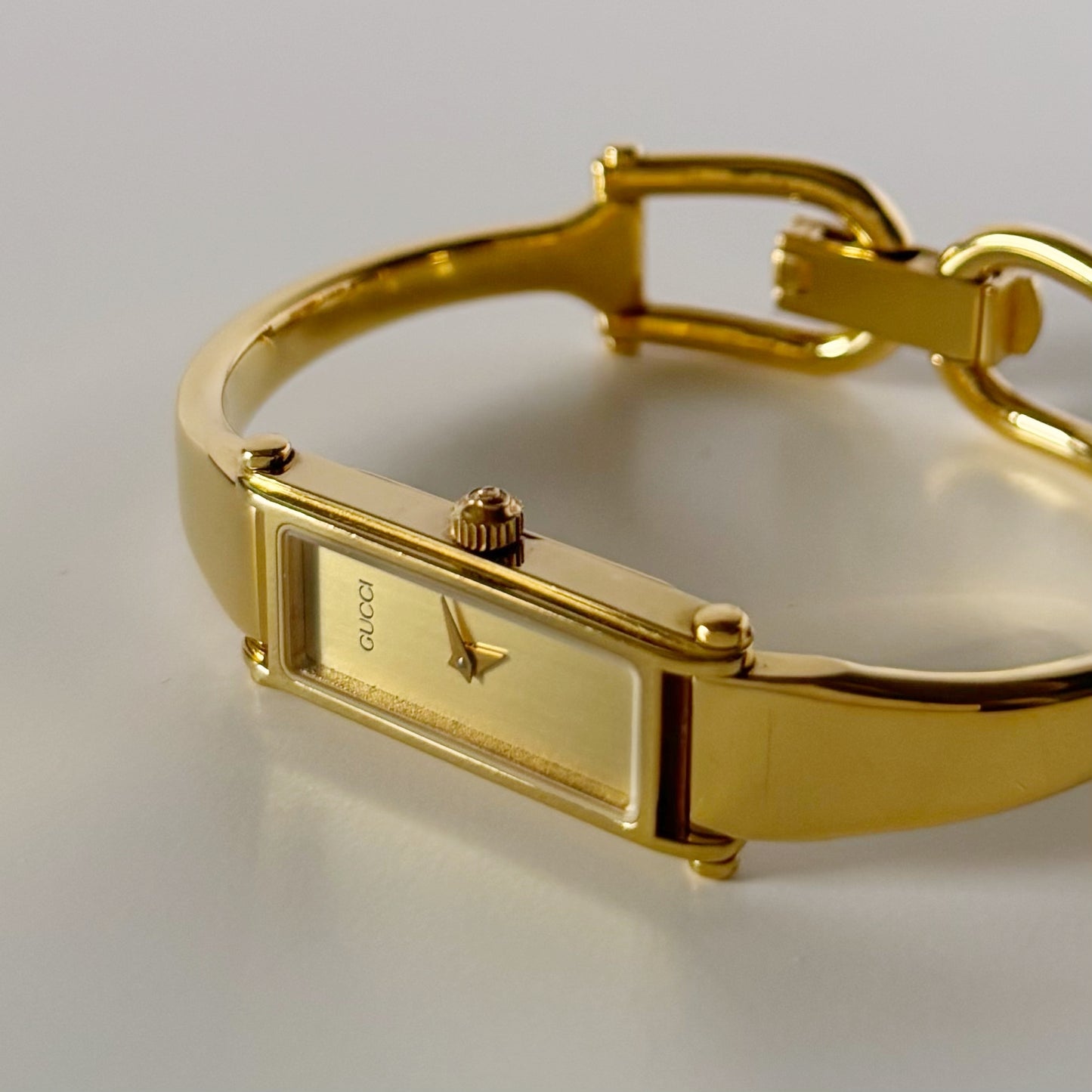 Gucci 1990s Gold Dial Rectangular Gold Plated Bangle Watch