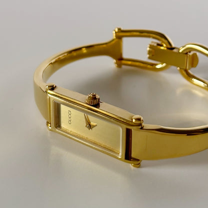 Gucci 1990s Gold Dial Rectangular Gold Plated Bangle Watch