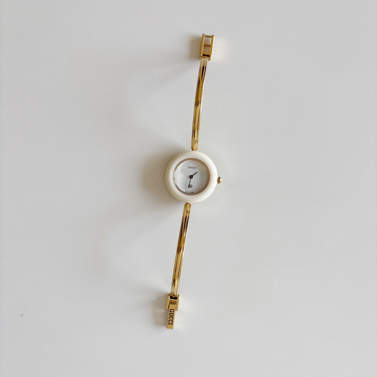 Gucci 1990s Interchangeable Bezel Gold Plated Bangle Watch with 12 bezels, case