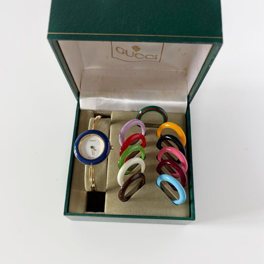 Gucci 1990s Interchangeable Bezel Gold Plated Bangle Watch with 12 bezels, case