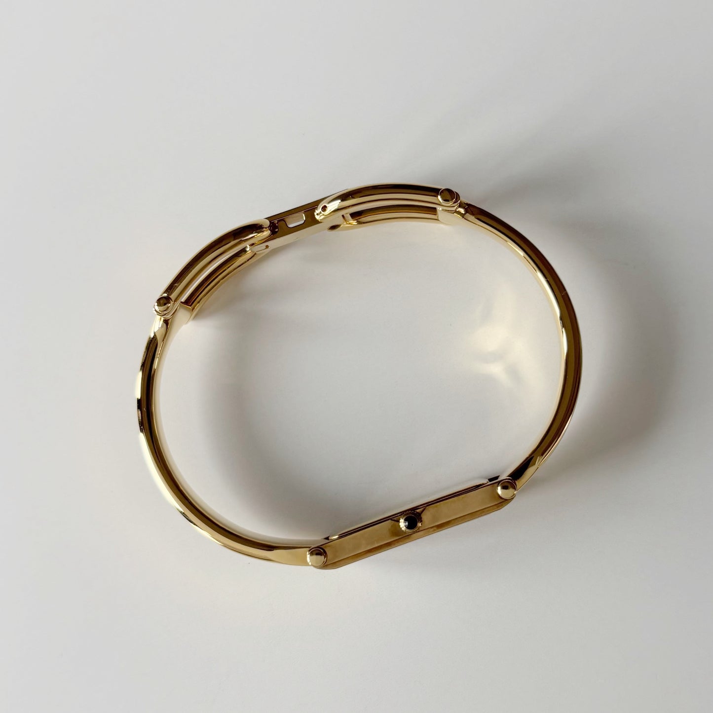 Gucci 1990s Gold Rectangular Dial Gold Plated Bangle Watch