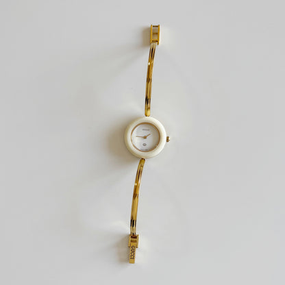 Gucci 1990s Interchangeable Bezel Gold Plated Bangle Watch with 12 bezels, case