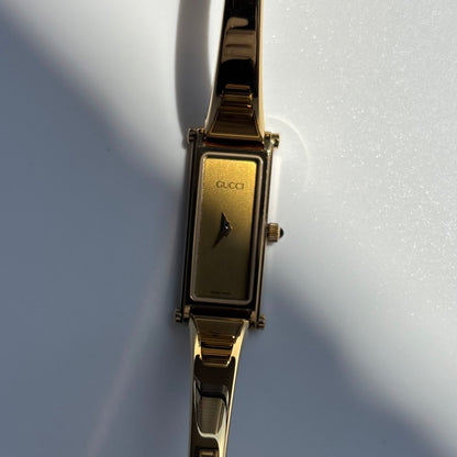 Gucci 1990s Gold Rectangular Dial Gold Plated Bangle Watch