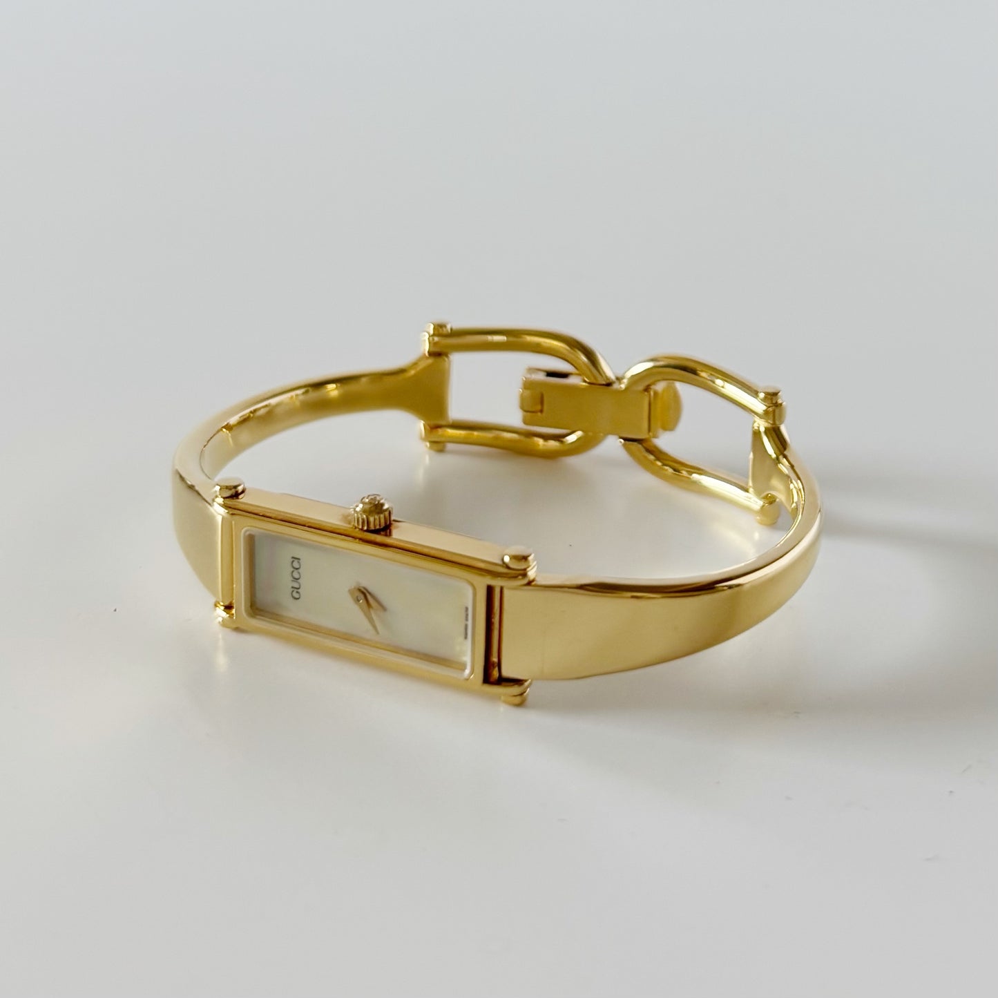 Gucci 1990s Seashell Rectangular Dial Gold Plated Bangle Watch