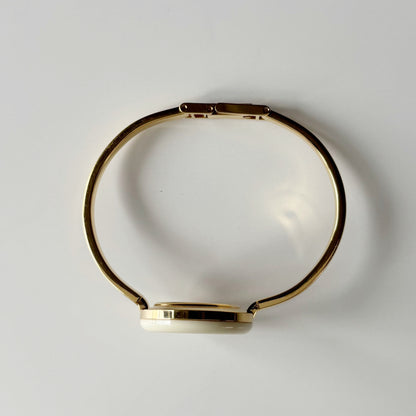 Gucci 1990s Interchangeable Bezel Gold Plated Bangle Watch with 12 bezels, case