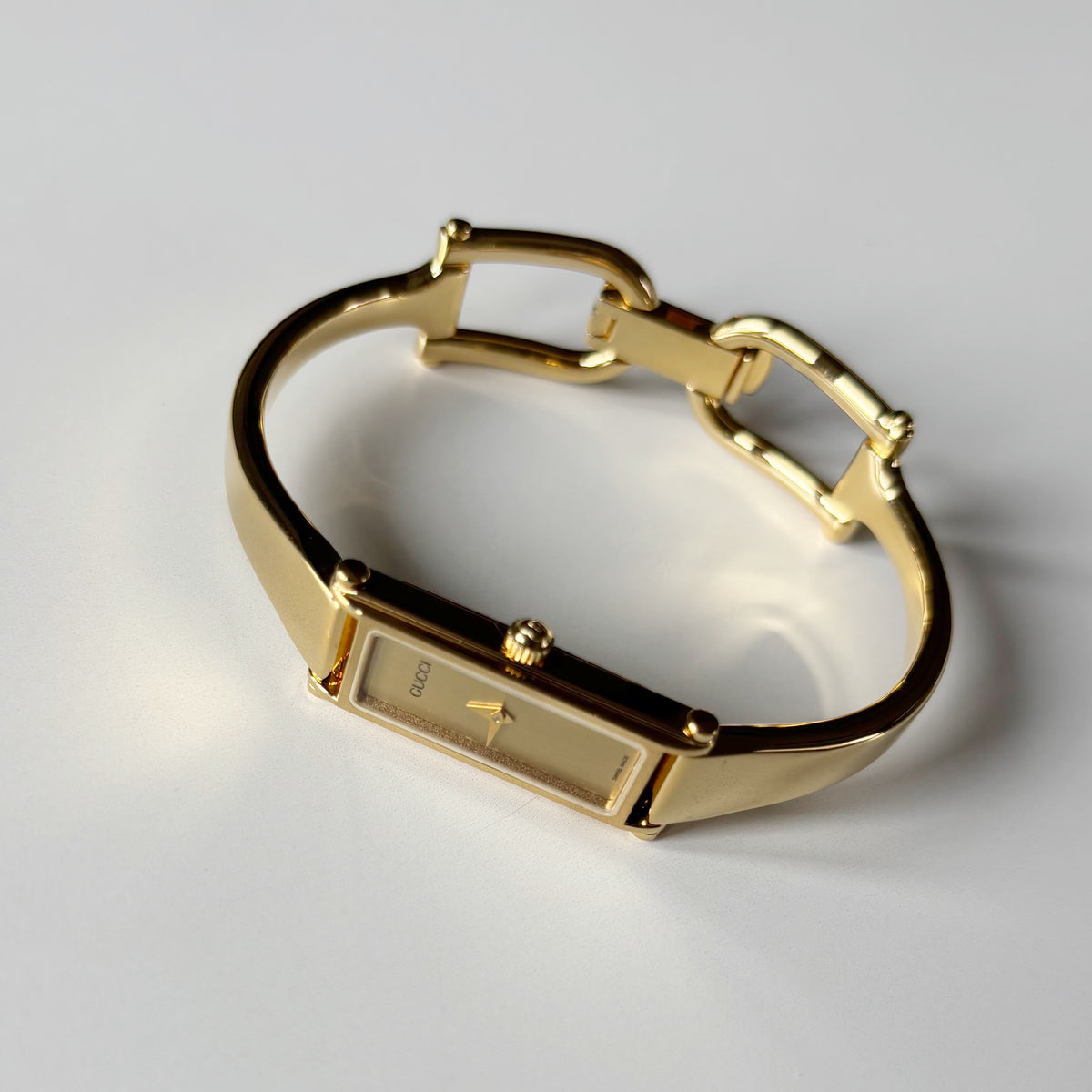 Gucci 1990s Gold Rectangular Dial Gold Plated Bangle Watch