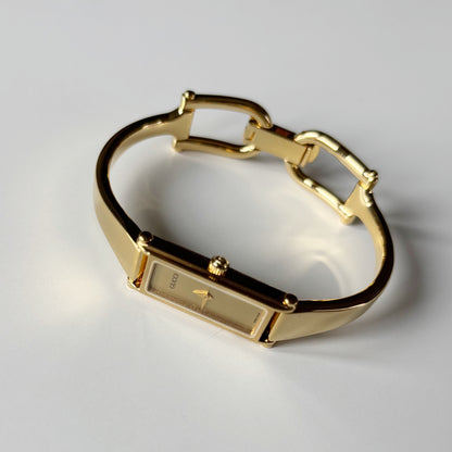 Gucci 1990s Gold Rectangular Dial Gold Plated Bangle Watch