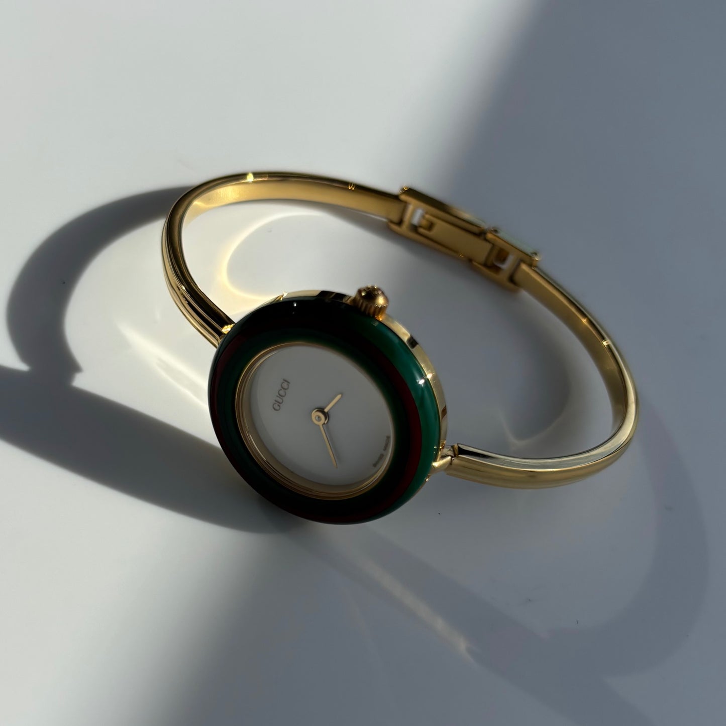 Gucci 1990s Interchangeable Bezel Gold Plated Bangle Watch with 12 bezels, case