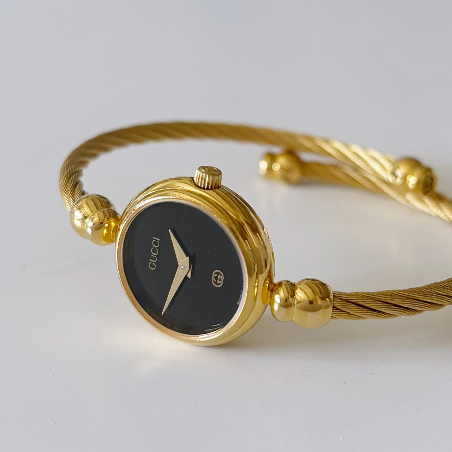 Gucci 1990s Black Dial Gold Plated Bangle Watch