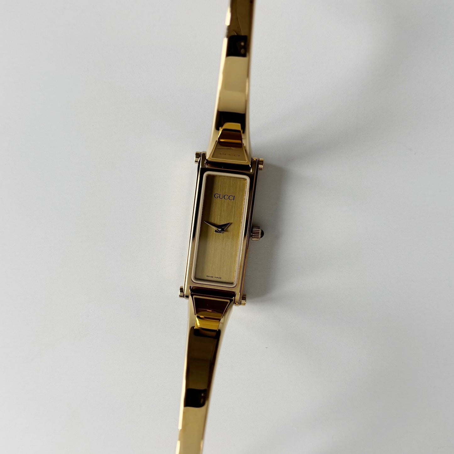 Gucci 1990s Gold Rectangular Dial Gold Plated Bangle Watch