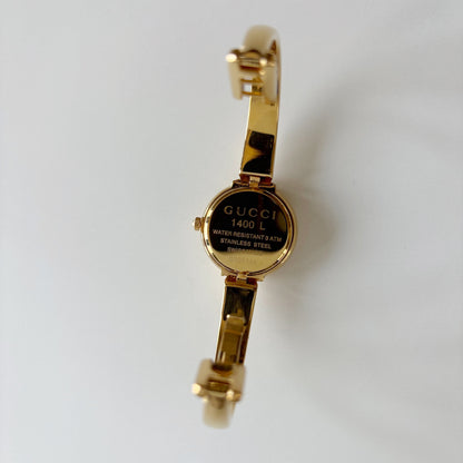 Gucci 1990s Round Dial Gold Plated Bangle Watch
