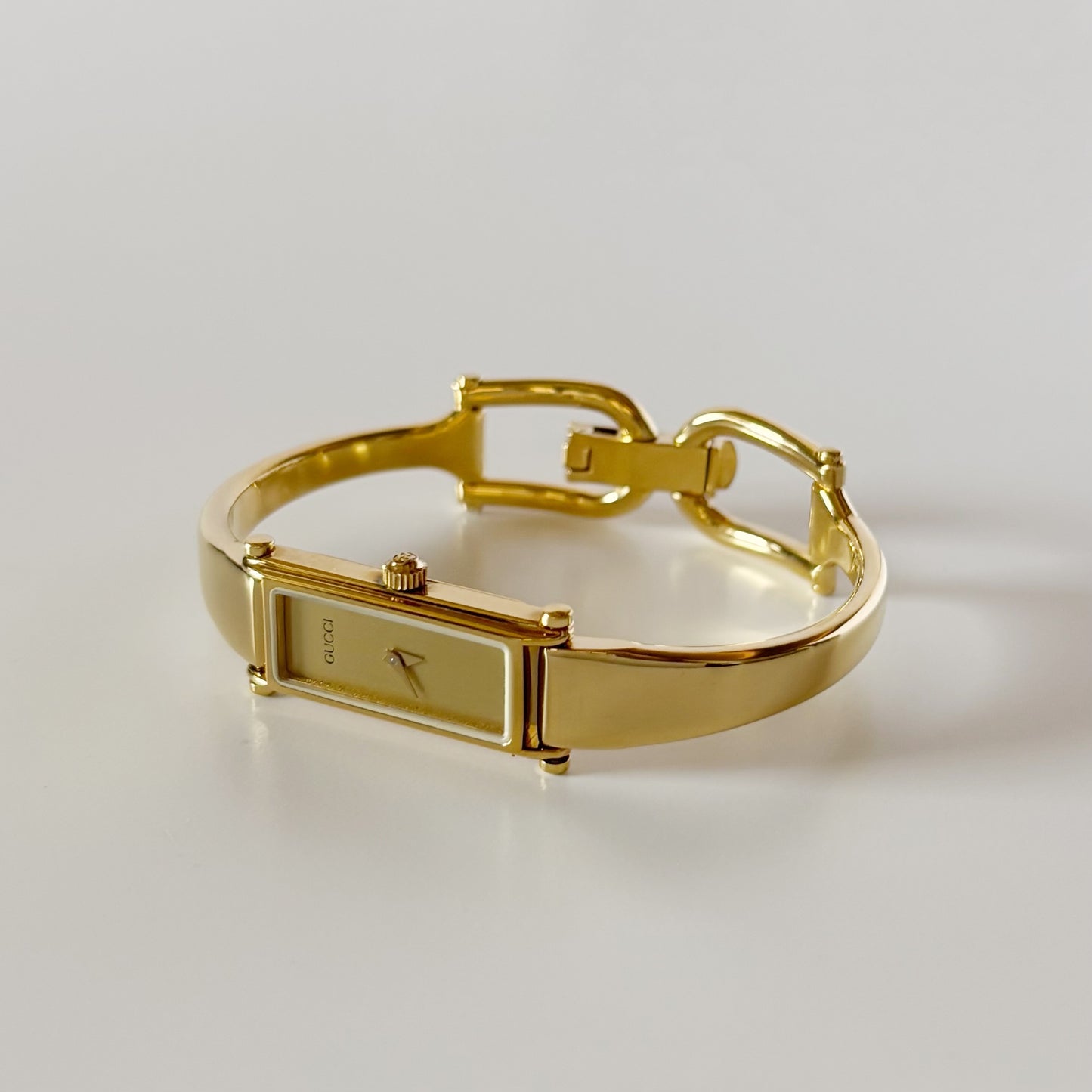 Gucci 1990s Gold Rectangular Dial Gold Plated Bangle Watch