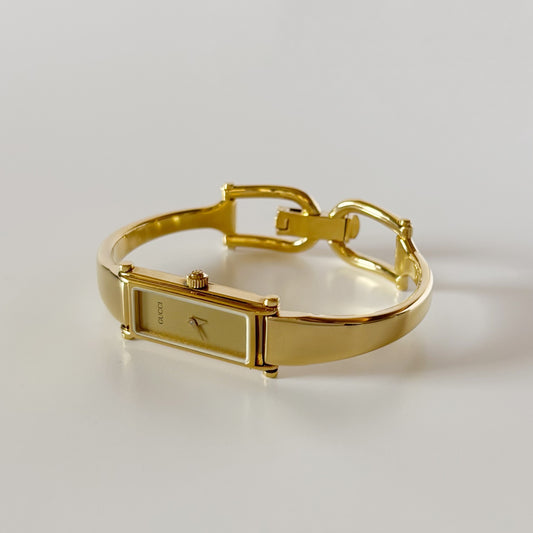 Gucci 1990s Gold Rectangular Dial Gold Plated Bangle Watch