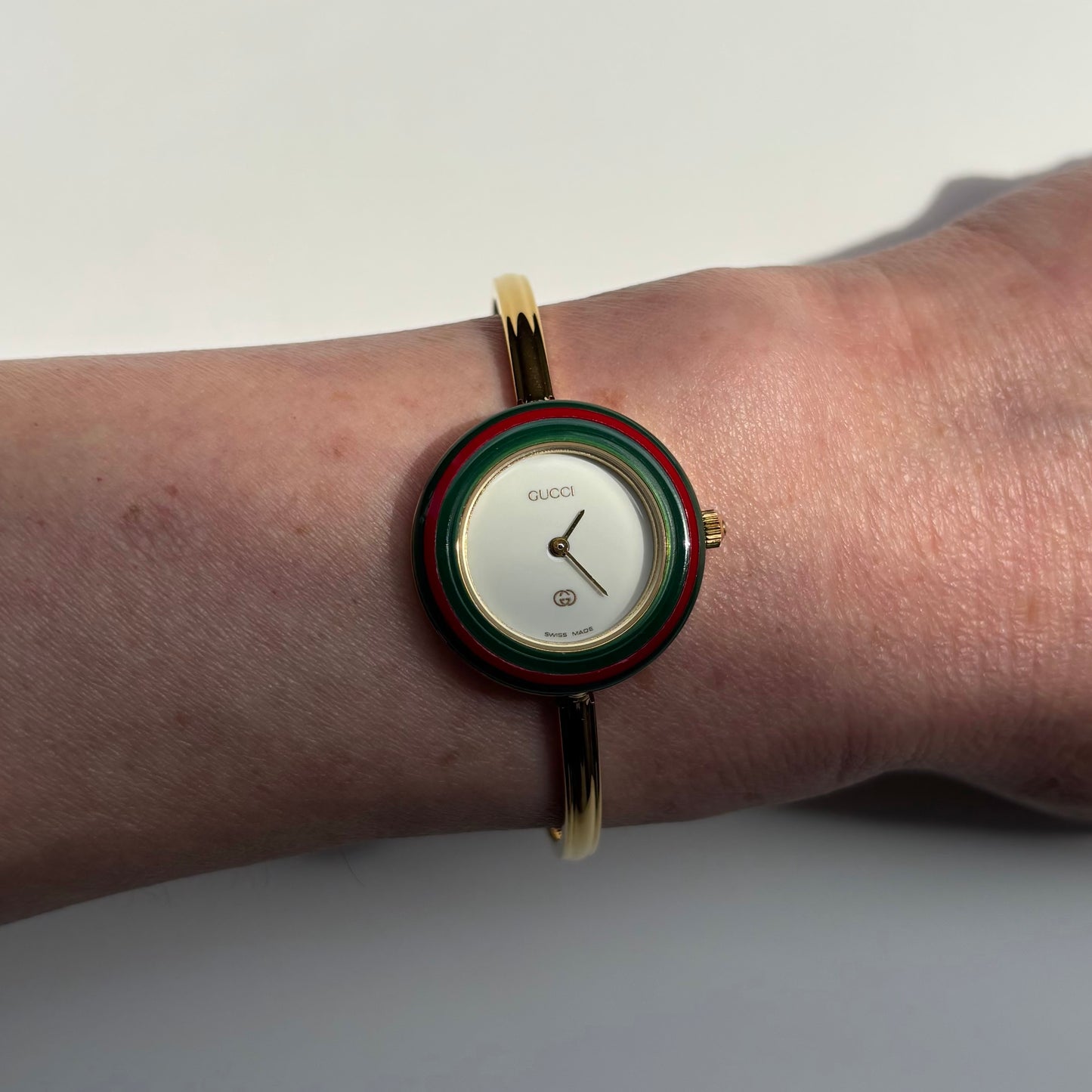 Gucci 1990s Interchangeable Bezel Gold Plated Bangle Watch with 12 bezels, case