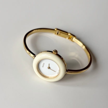 Gucci 1990s Interchangeable Bezel Gold Plated Bangle Watch with 12 bezels, case