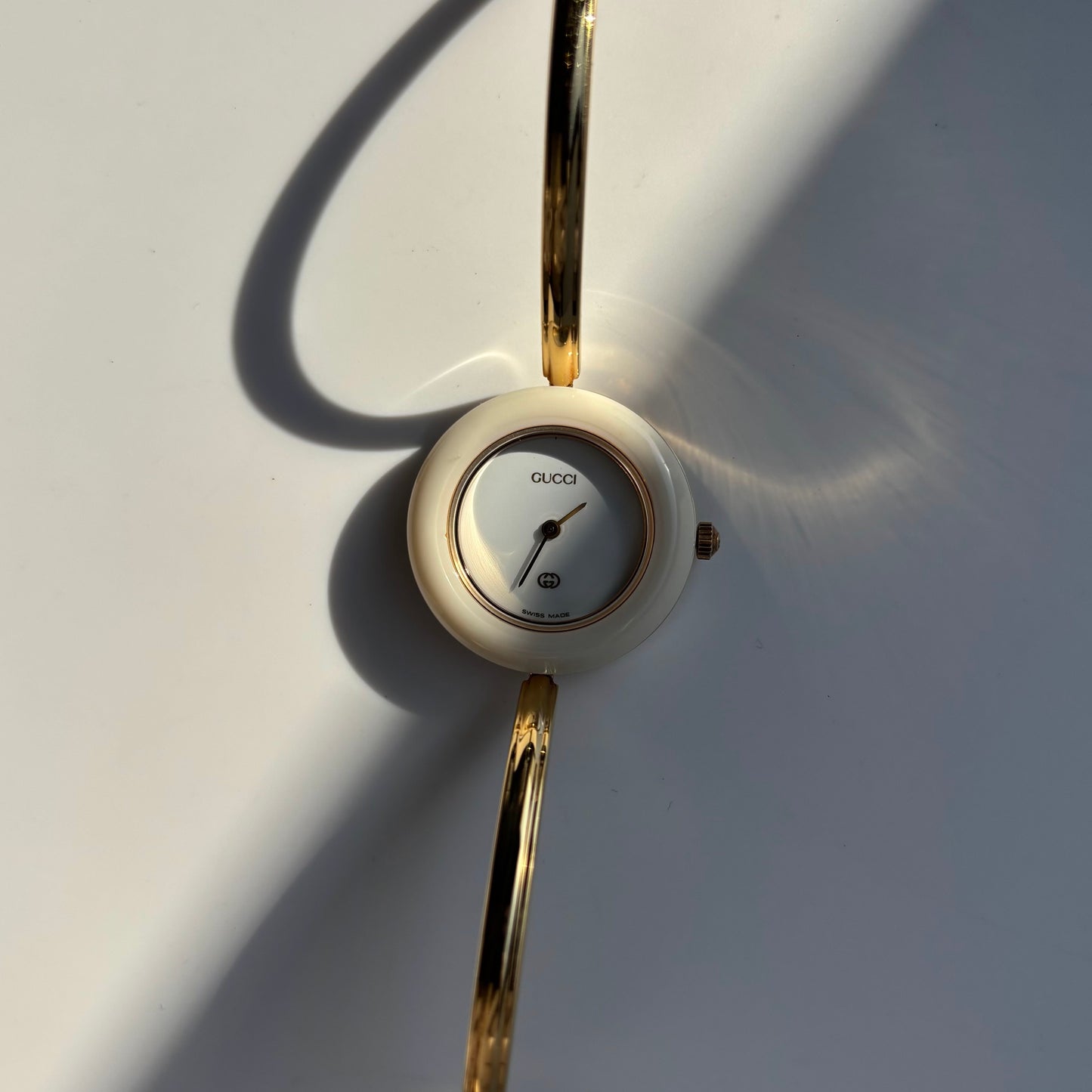Gucci 1990s Interchangeable Bezel Gold Plated Bangle Watch with 12 bezels, case