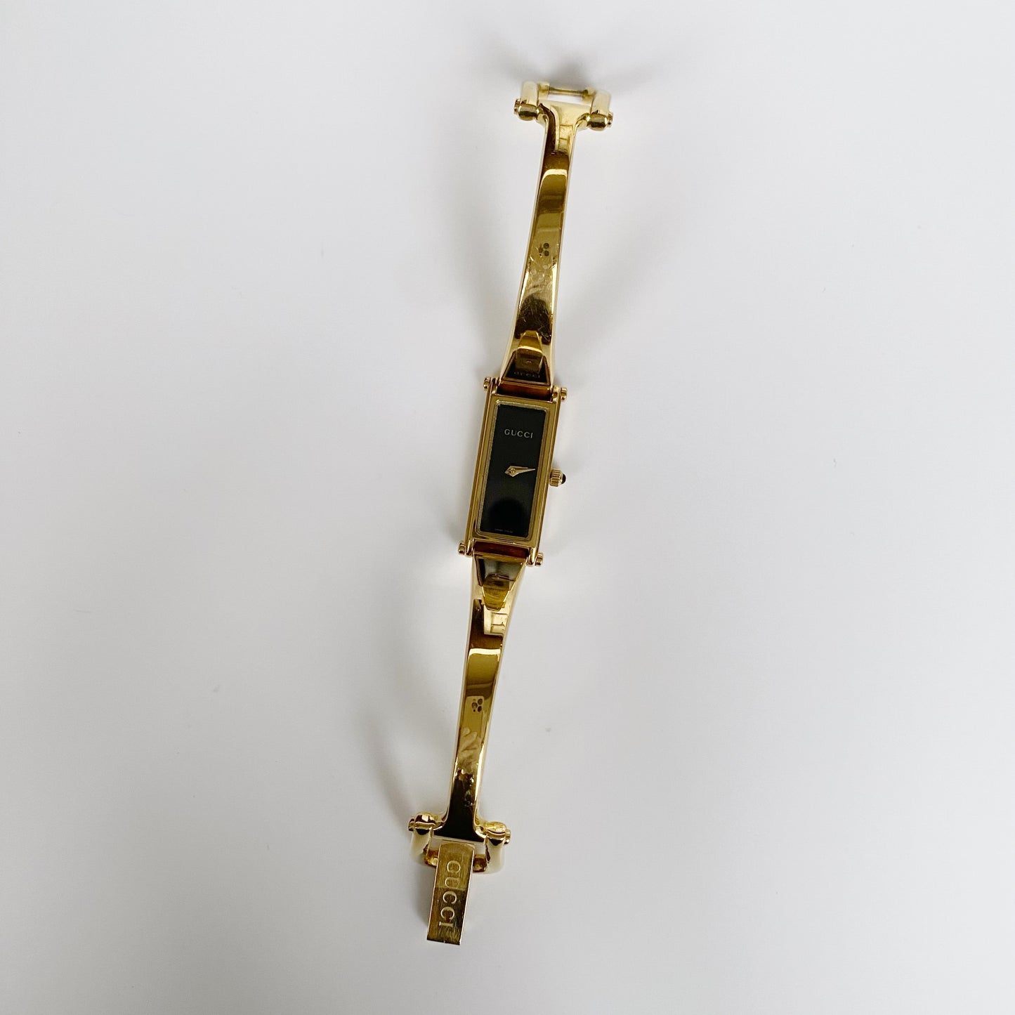 Gucci 1990s Black Dial Rectangular Gold Plated Bangle Watch