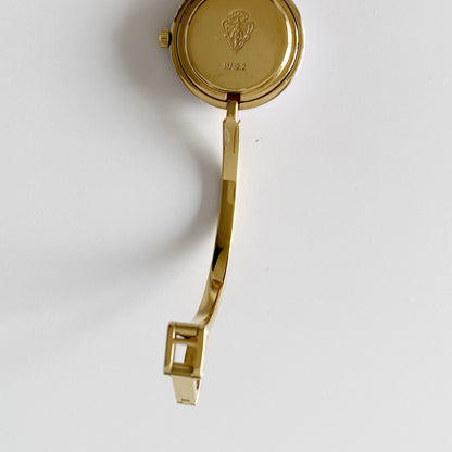 Gucci 1990s Interchangeable Bezel Gold Plated Bangle Watch with 12 bezels, case