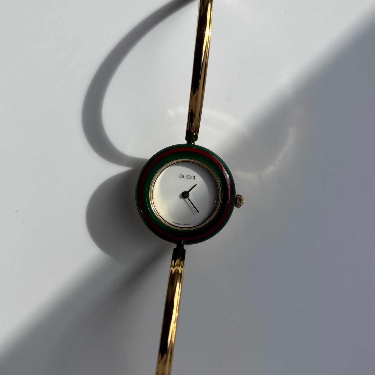 Gucci 1990s Interchangeable Bezel Gold Plated Bangle Watch with 12 bezels, case