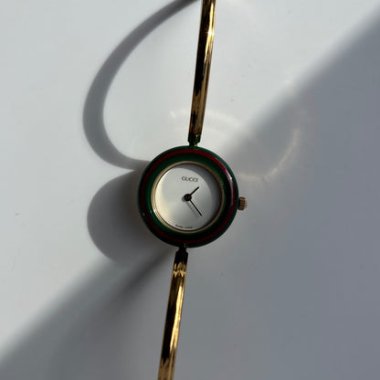 Gucci 1990s Interchangeable Bezel Gold Plated Bangle Watch with 12 bezels, case