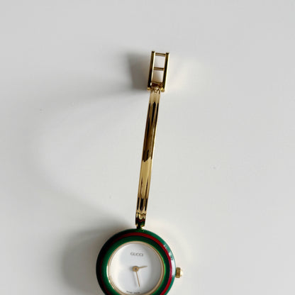 Gucci 1990s Interchangeable Bezel Gold Plated Bangle Watch with 12 bezels, case