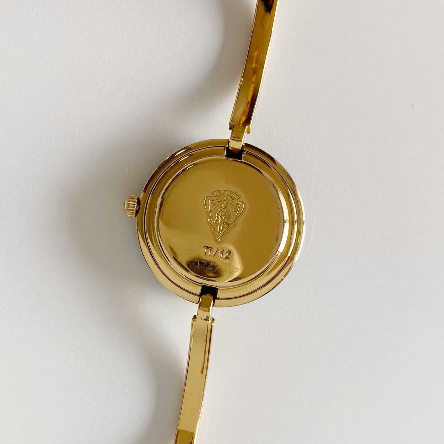Gucci 1990s Interchangeable Bezel Gold Plated Bangle Watch with 12 bezels, case