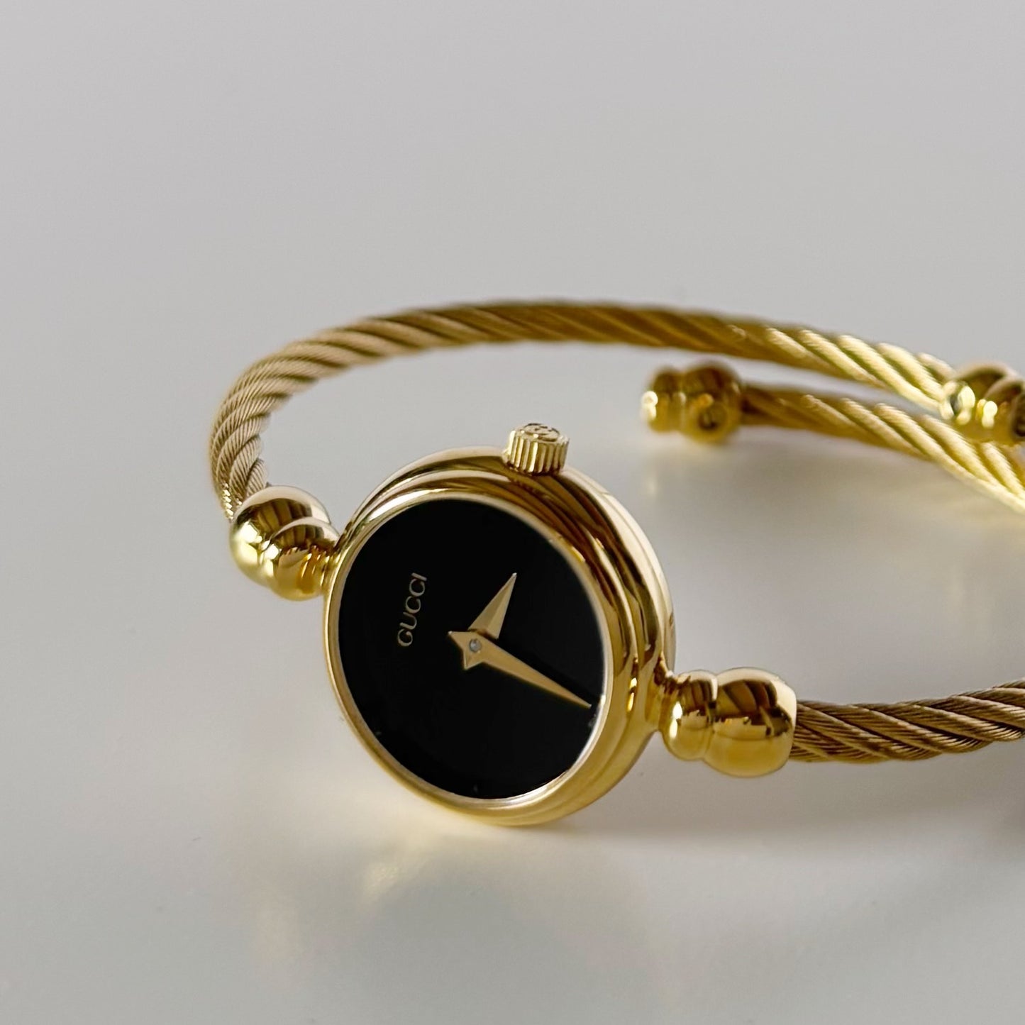 Gucci 1990s Black Dial Gold Plated Cable Bangle Watch
